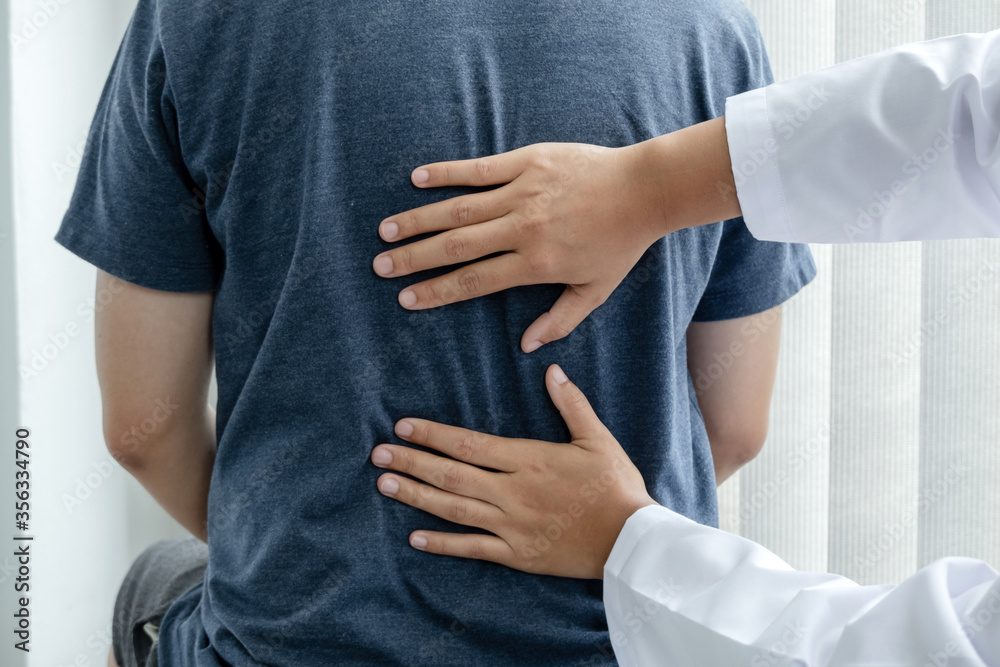 Male patients consulted physiotherapists with Low back pain for examination and treatment. Rehabilitation physiotherapy concept