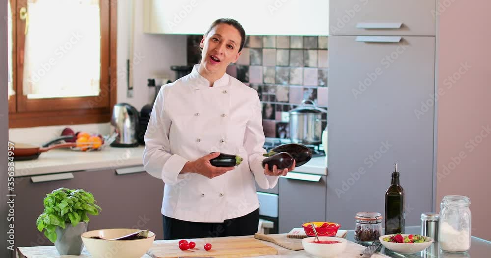 MS Female chef with eggplants in kitchen / Florence, Tuscany, Italy MS Female chef with eggplants in kitchen / Florence, Tuscany, Italy