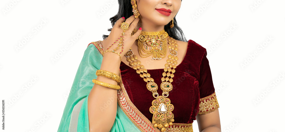 Beautiful girl with gold jewelry for woman ,necklace ,earrings and bracelet. Beauty and accessories.