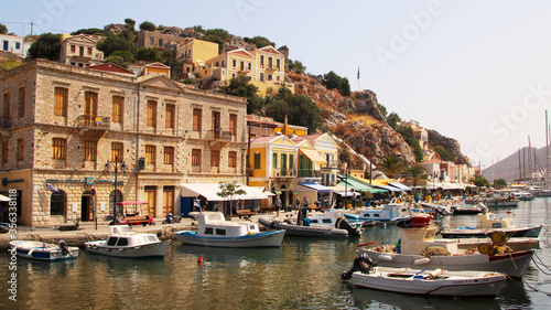 Symi town, Symi island, pictorial view of colorful houses and the harbour