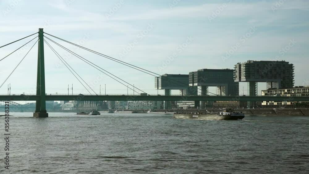WS Traffic on Severin Bridge over Rhine river and Crane Houses at Rheinau Harbor / Cologne, North Rhine Westphalia, Germany