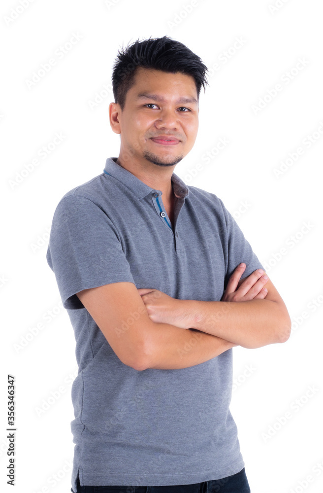 Smiling handsome Asian man in a gray polo shirt who has a beard, is standing with crossed arms. White isolated background. Smiling handsome Asian man in a gray polo shirt who has a beard, is standing with crossed arms. White isolated background.