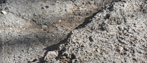 Broken asphalt is close-up  soft focus