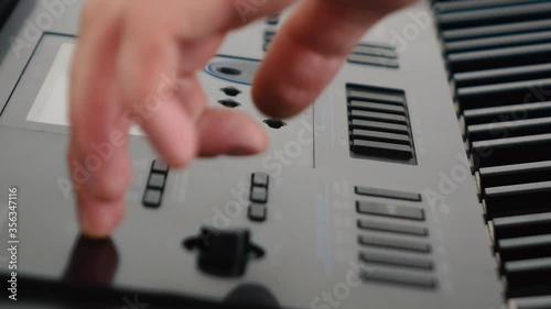 Wallpaper Mural a person sets up a synthesizer Torontodigital.ca