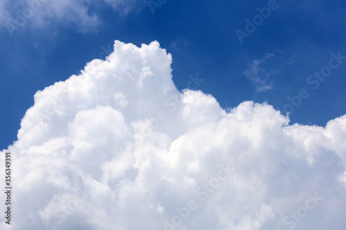 Blue sky with fluffy cloud