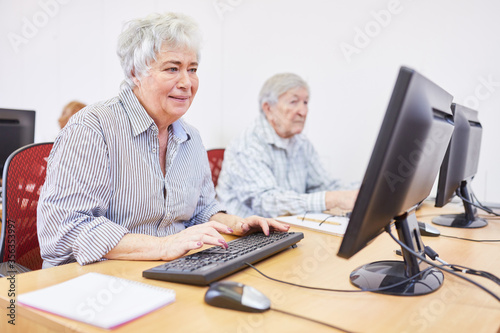 Elderly woman on the PC during a computer training