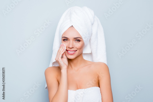 Close up photo portrait of attractive beautiful brunette in shower she her using cotton disk to apply night cream towel on head hair isolated on grey background