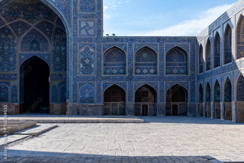 Colorful ornamental courtyard of decorated at Shah Mosque of Isfahan, Iran
