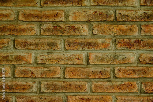 Handmade old red brick wall