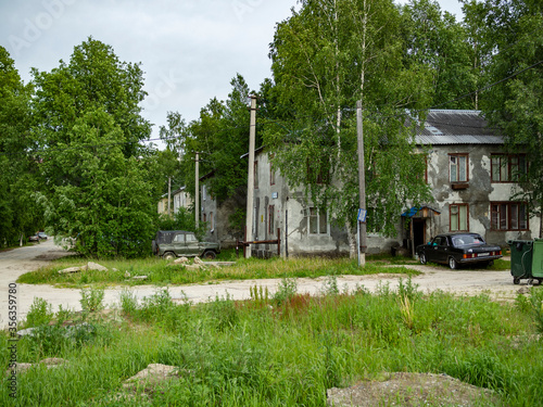 Surgut, Khanty-Mansi Autonomous Okrug / Russia - 06.09.2020: Old houses made of wood and plastered in which people still live © IURII