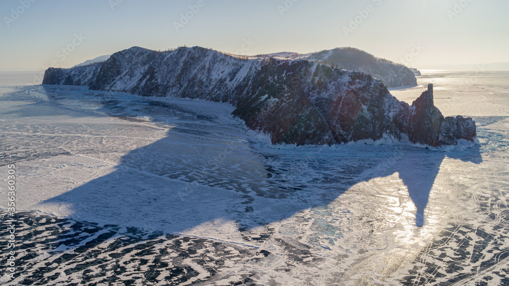 Φωτογραφία Baikal water lake winter season aerial view with sunrise sky, Russia natural landscape
