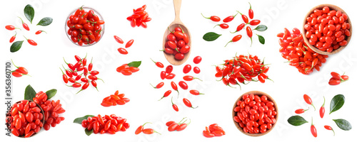 Set of fresh goji berries on white background, top view. Banner design