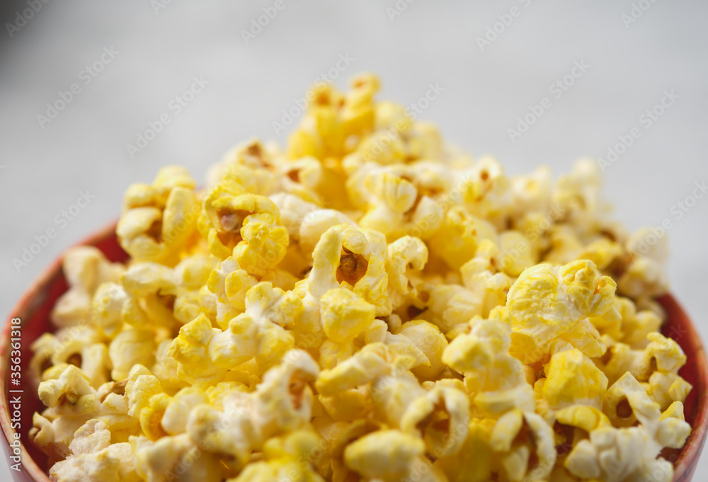Salted Cheese Popcorn in a Brown Bowl. Salted Cheese Popcorn in a Brown Bowl.