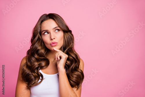 Closeup photo of pretty wavy minded lady arm hand on chin interested look up empty space creative intelligent mind wear white casual singlet isolated pastel pink color background