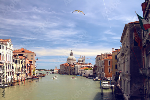 Summer view of Grand Canal with Santa Maria della Salute Basilica from Academia bridge. Venice. Italy.