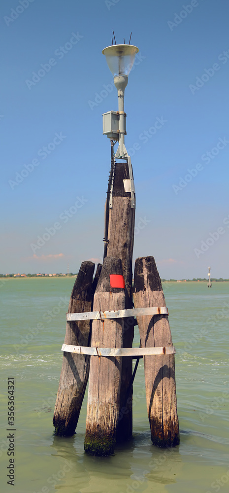 Old wooden Beacon in Venetian Lagoon. Venice. Italy.
