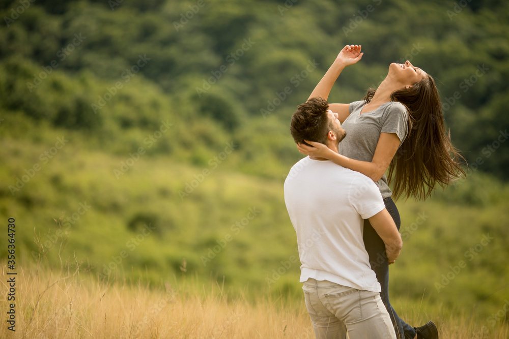 Pretty young couple in love outside in spring nature Pretty young couple in love outside in spring nature