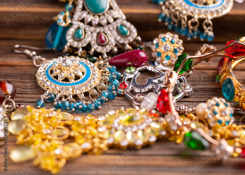 Female jewelry on a wooden table. Female jewelry on a wooden table.