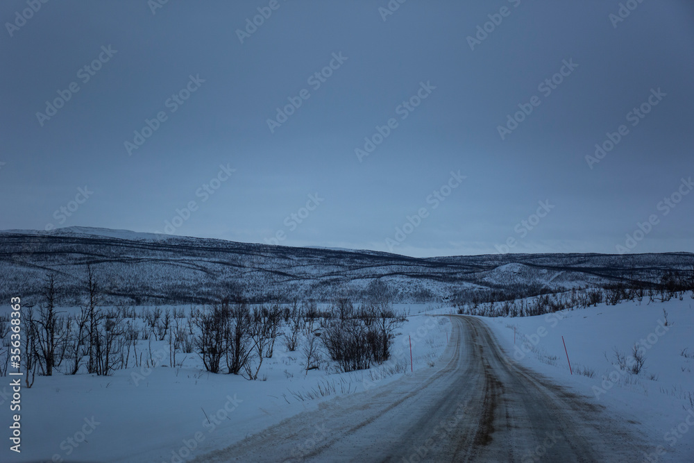 Winter road in Nuorgam, Lapland, Finland Winter road in Nuorgam, Lapland, Finland