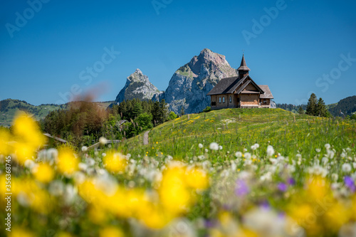 Bergkapelle Stoos vor dem Mythen im Bergsommer photo