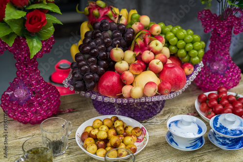 Glass porcelain basket with ripe fresh fruits