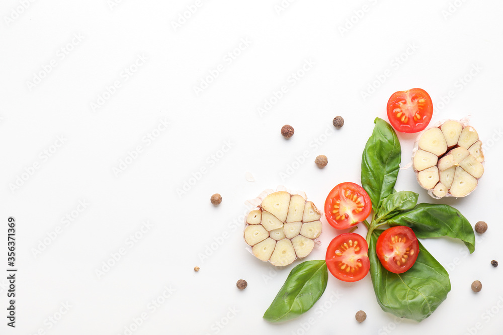 Fototapeta Composition with basil, tomatoes and spices on white background