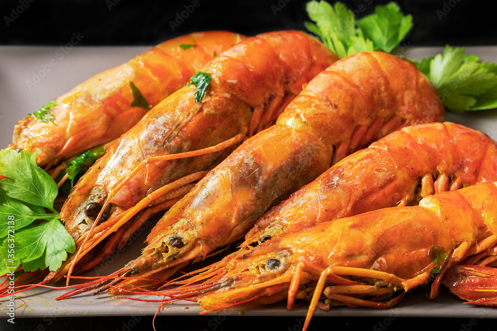 Some beautiful cooked prawns with parsley.