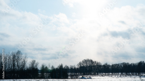 Landscape of snow covered countryside with beautiful sky