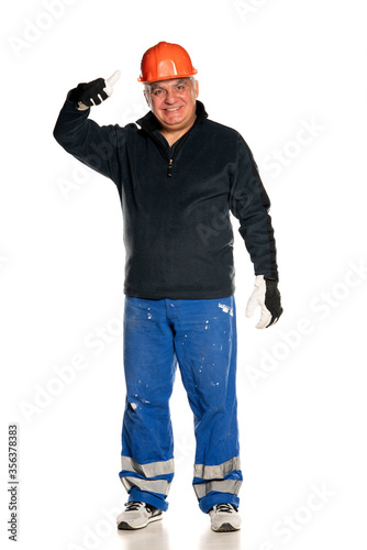 man with protective equipment showing thumbs up