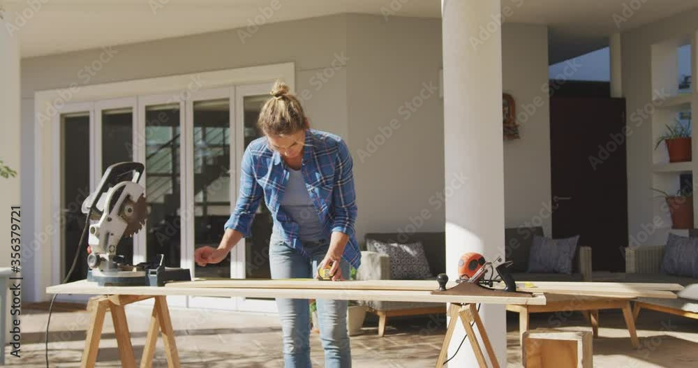 Woman in self isolation in quarantine during coronavirus pandemic does outdoor work