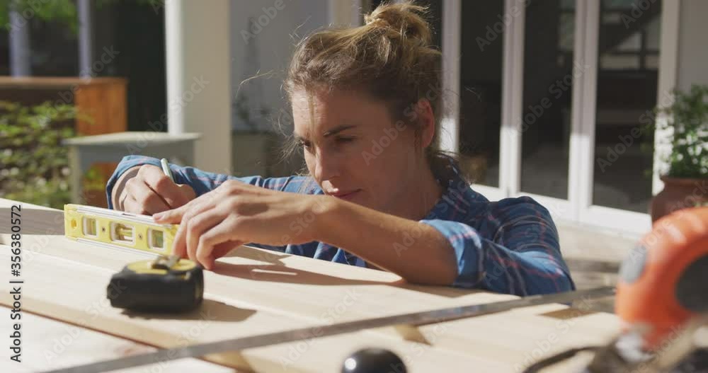 Woman in self isolation in quarantine during coronavirus pandemic does outdoor work