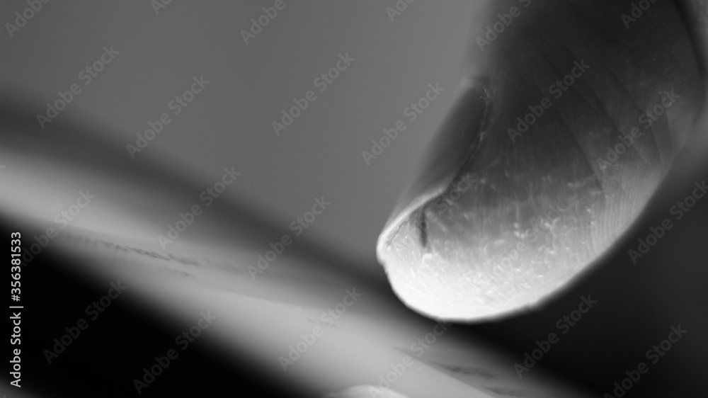 Obraz premium Macro of a finger on a mobile phone.