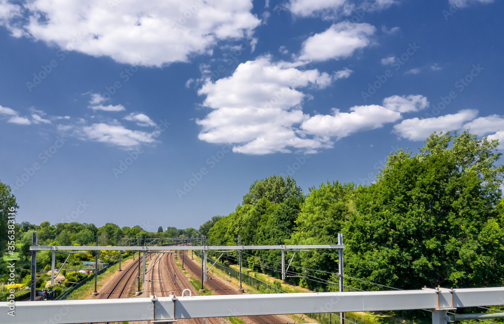 Friendly clouds above the railway track in Rijswijk (NL) Friendly clouds above the railway track in Rijswijk (NL)
