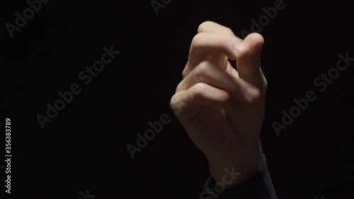 Hand snapping fingers with black background - different snaps of fingers