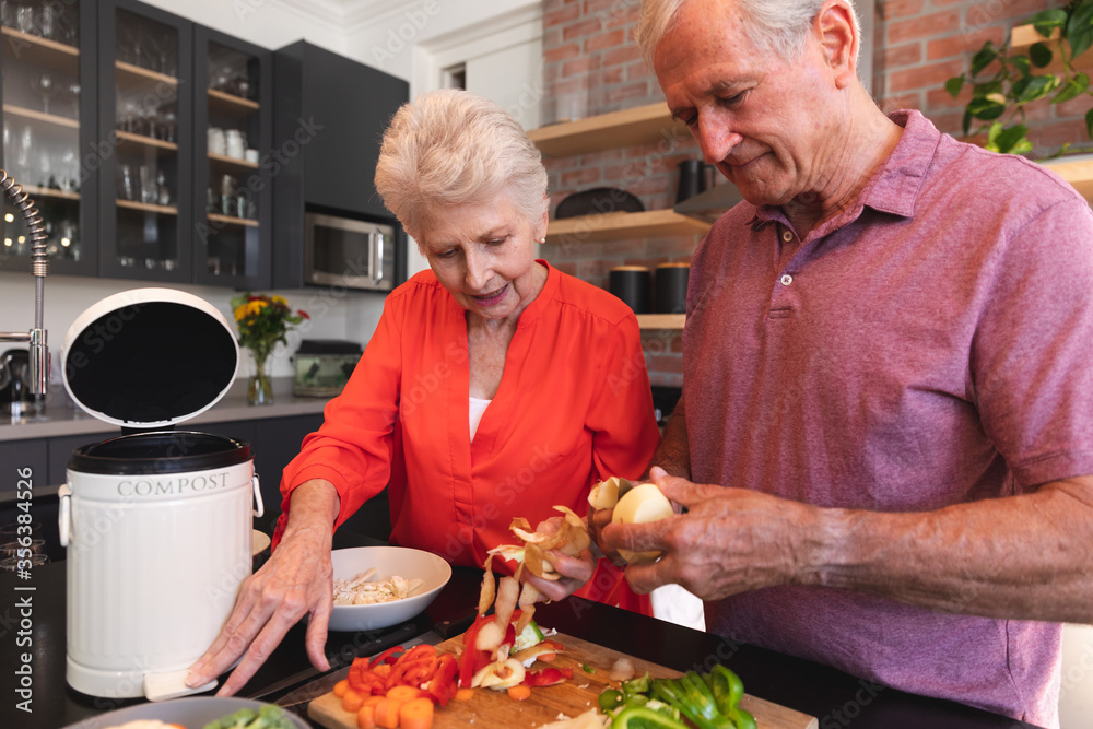 Caucasian senior couple cooking together at home Caucasian senior couple cooking together at home
