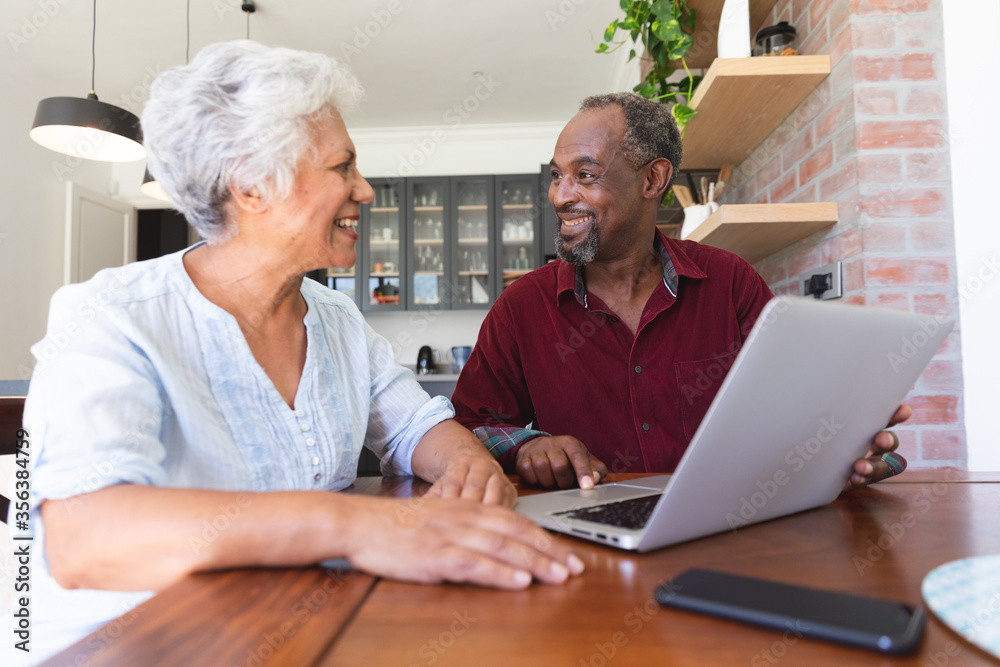 Senior African American couple using laptop Senior African American couple using laptop