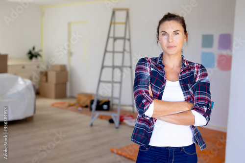  Woman in Social Distancing looking at camera at home