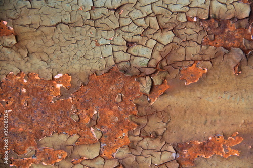 Rusty, orange surface of weathered iron plate, machine.