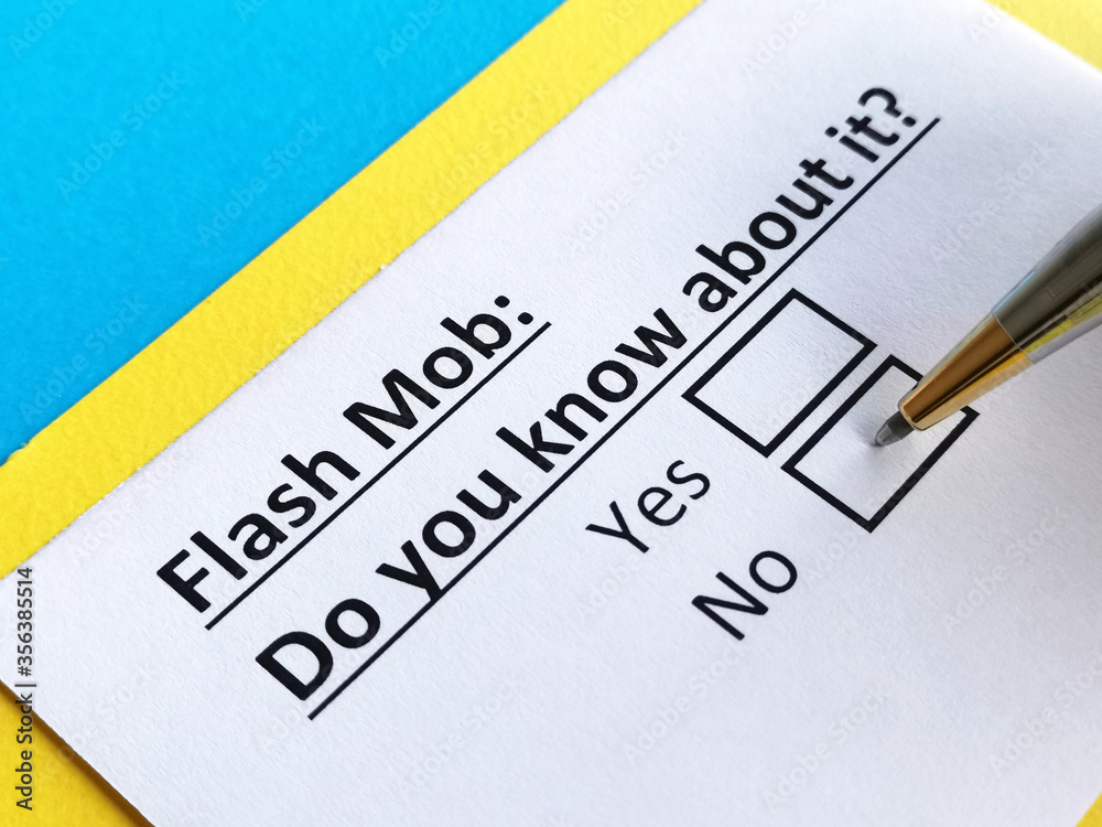 One person is answering question about flash mob. One person is answering question about flash mob.