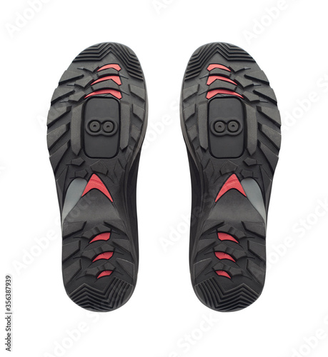 Sole of clipless or clip-in cycling shoes isolated on white background photo