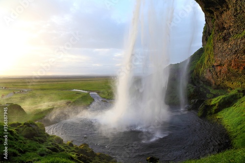 Amazing Iceland: Seljalandsfoss Waterfall with trail behind the falls.