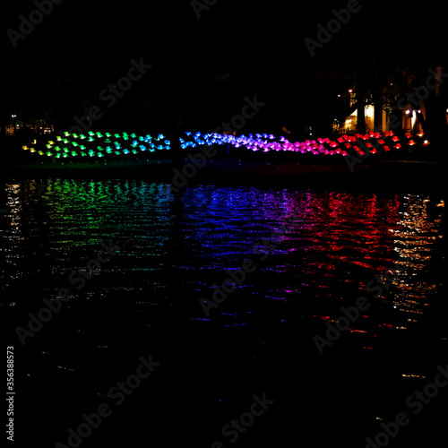 Amsterdam,the Netherlands-Dec 14, 2014:Big construction colourful red, blue, green and purple coloured lights canal during Amsterdam light festival.