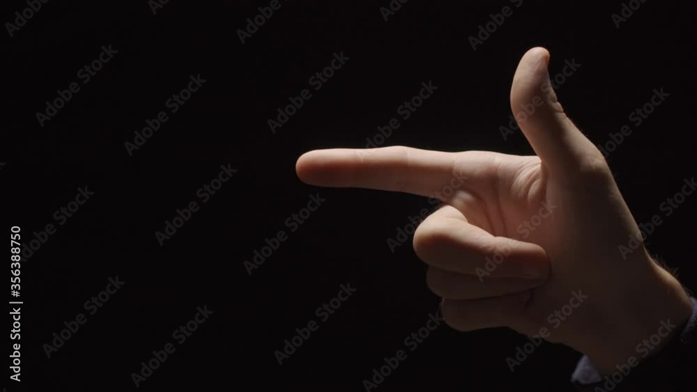 Hand making a gun gesture enters frame and shoots one shot and exits Hand making a gun gesture enters frame and shoots one shot and exits