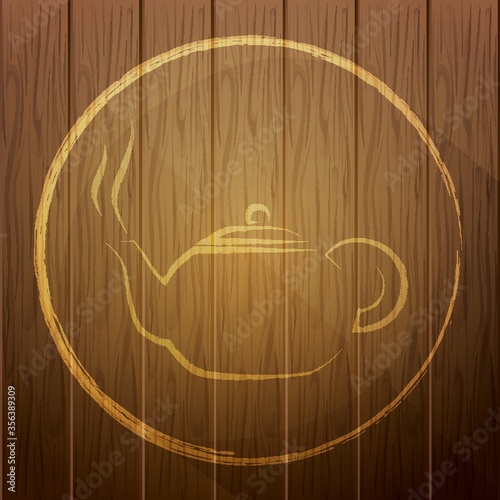 teapot on wooden background