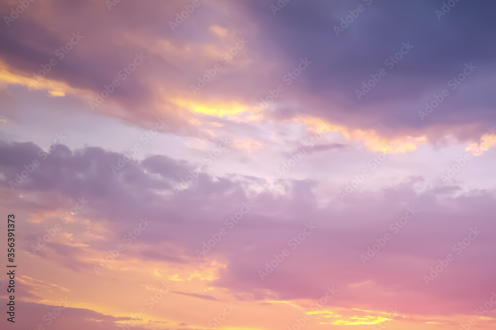 scenic sky background captured on the sunset, sky view in bright pink, blue, yellow, purple natural colors with gradient, sky texture, sunset bright sky