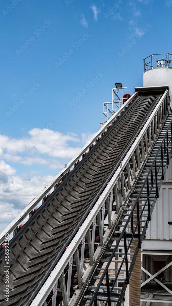 belt conveyor - transport of raw material on the production line - clean factory 