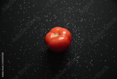 Tomato isolated on a black ...