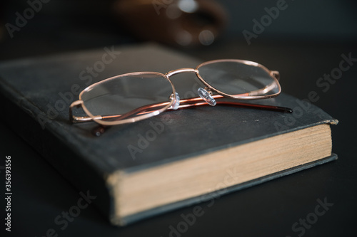 old book and glasses