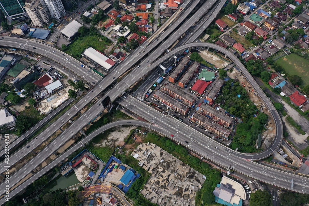 bird eye view of technology cross shape multi level road highway