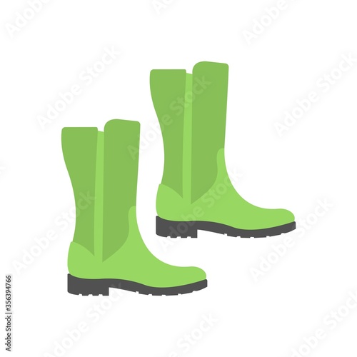 Green rubber boots icon in flat design style. Creative design element.